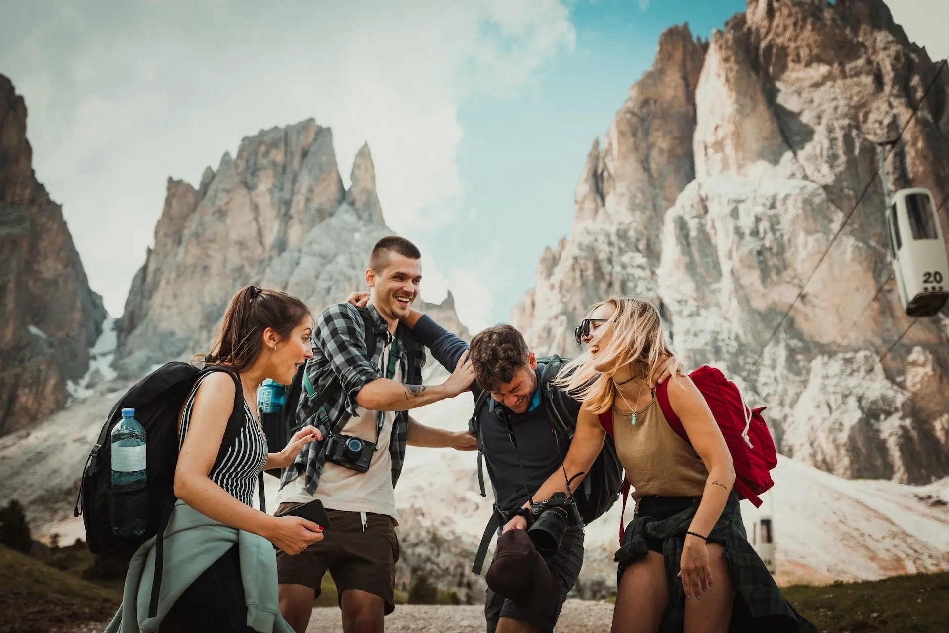 A group of friends celebrating the hike to a mountain